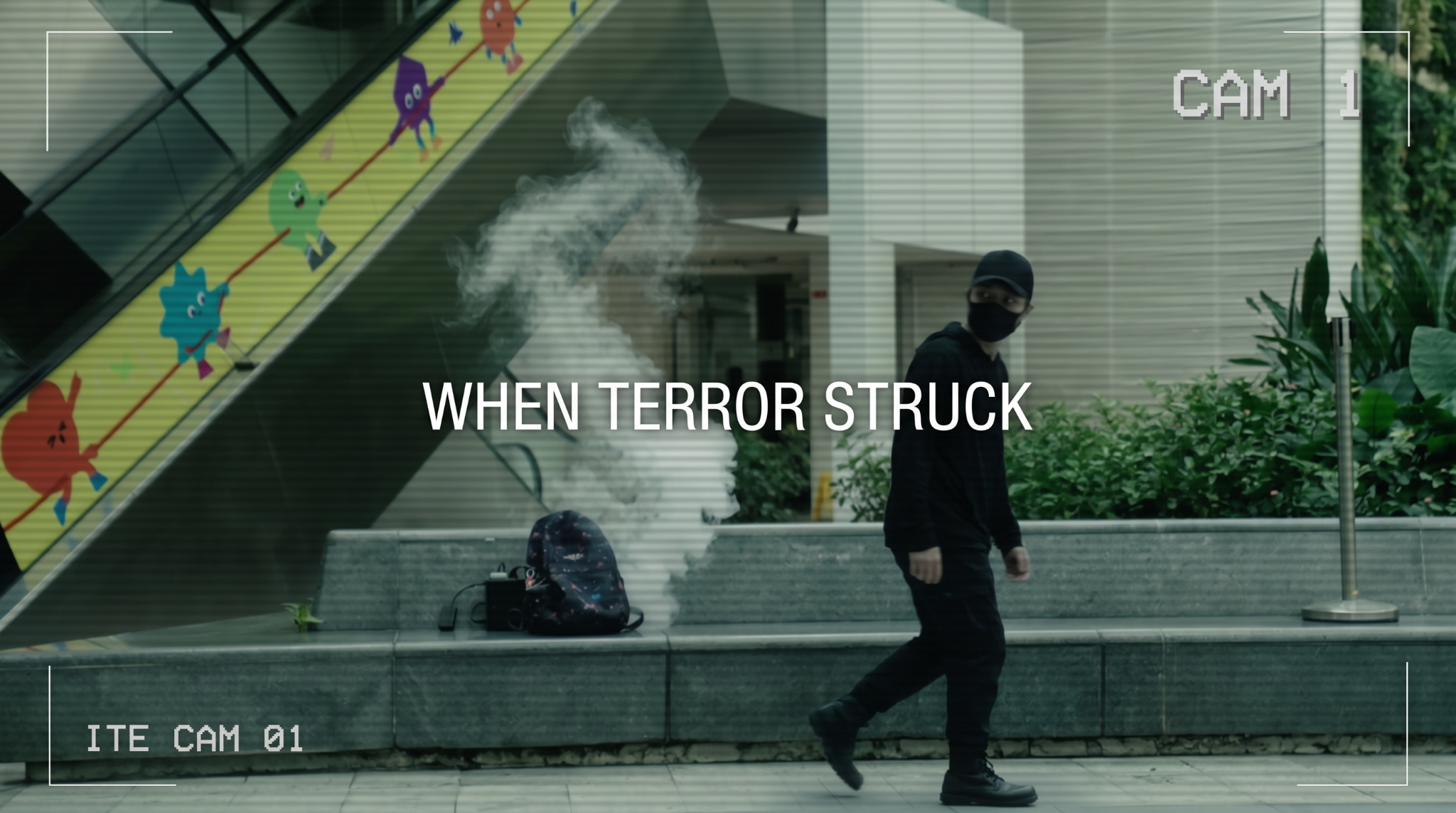 Suspicious character leaving bag with smoke behind 
